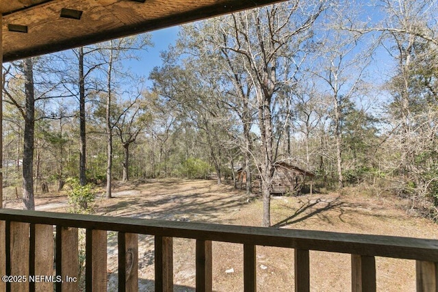 view of yard with a balcony