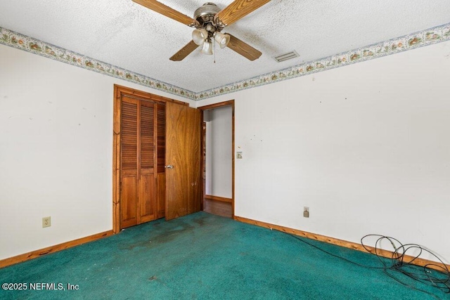 unfurnished bedroom with carpet, visible vents, a closet, and a textured ceiling