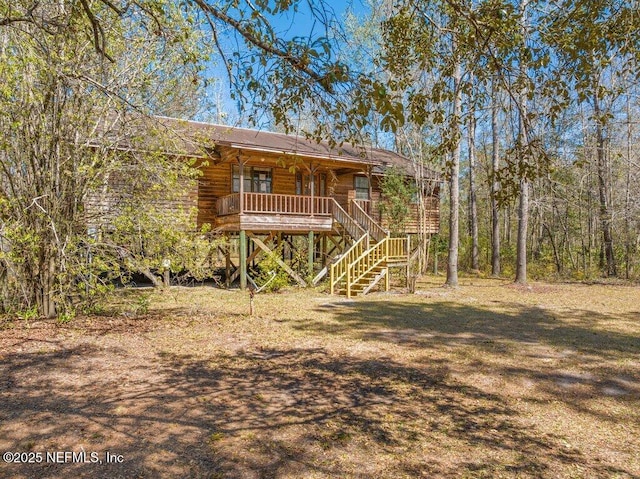 exterior space with covered porch and stairs