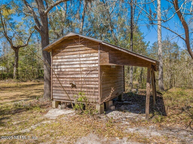 view of shed featuring a wooded view