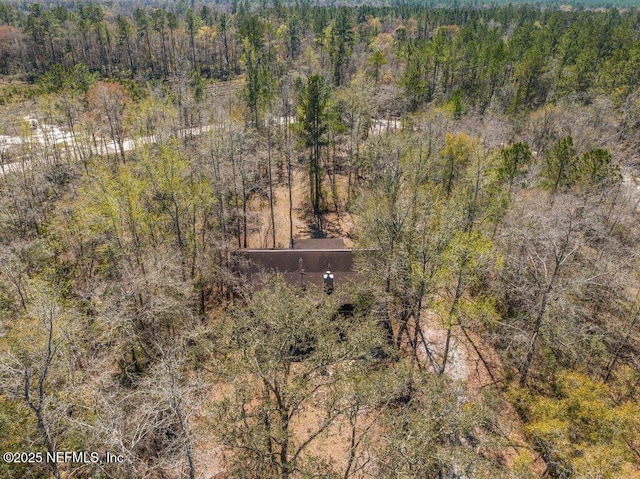 drone / aerial view with a view of trees