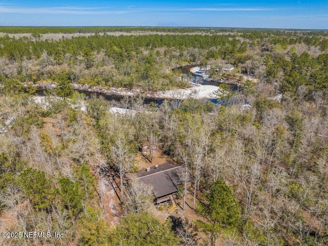 drone / aerial view with a view of trees