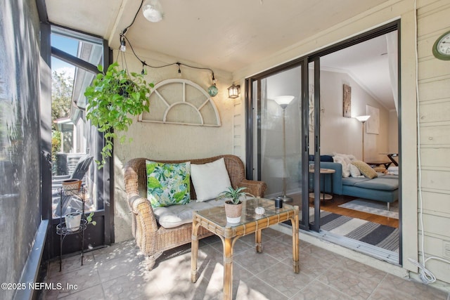 sunroom / solarium featuring vaulted ceiling