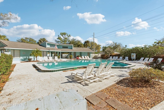 pool with fence and a patio area