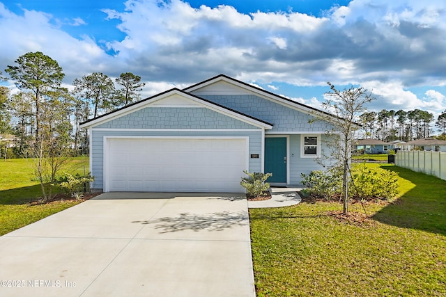 view of front of property featuring a front yard, an attached garage, driveway, and fence