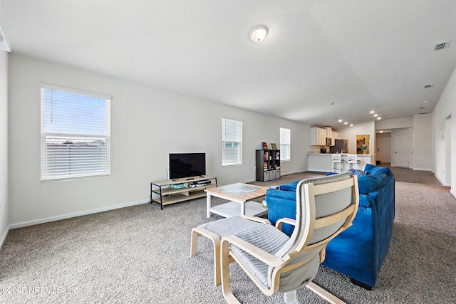 192 Logrono Ct, Saint Augustine, FL 32084 - living area with light colored carpet, visible vents, and baseboards