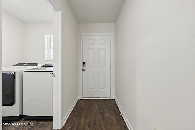 192 Logrono Ct, Saint Augustine, FL 32084 - clothes washing area with dark wood finished floors, laundry area, washing machine and dryer, and baseboards