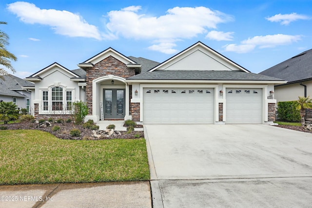 single story home with a front yard, driveway, an attached garage, stucco siding, and french doors