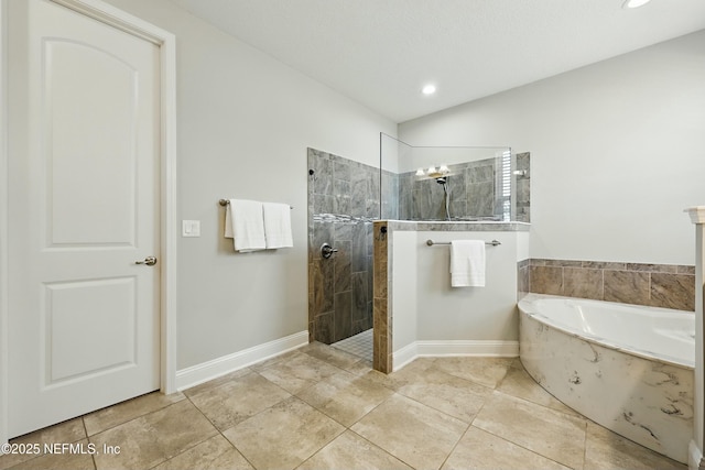 full bathroom featuring baseboards, walk in shower, a bath, and tile patterned flooring