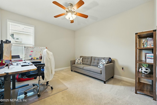 home office featuring carpet flooring, baseboards, and ceiling fan