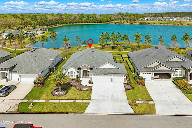 aerial view featuring a water view and a residential view