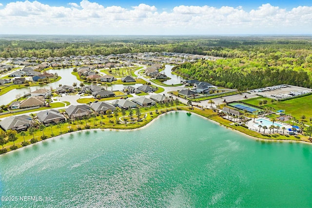 drone / aerial view featuring a residential view and a water view