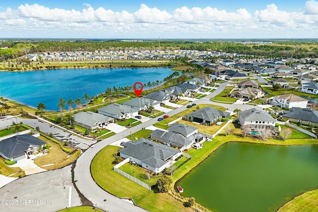 bird's eye view featuring a residential view and a water view