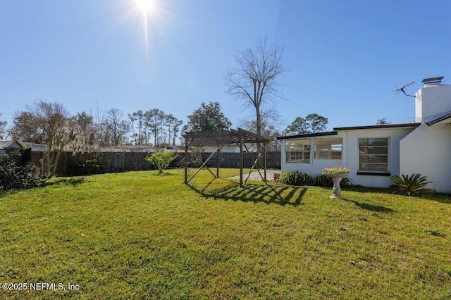 view of yard with a pergola and a fenced backyard