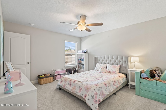 bedroom featuring baseboards, a textured ceiling, a ceiling fan, and carpet