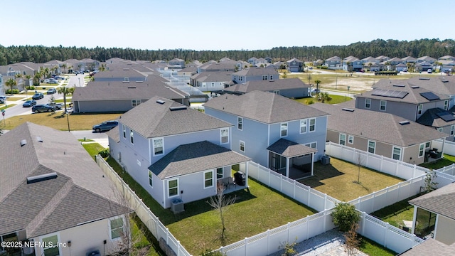 birds eye view of property with a residential view