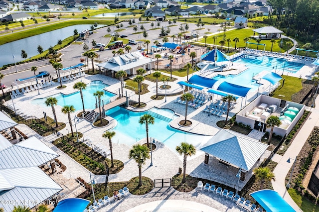 bird's eye view with a residential view and a water view