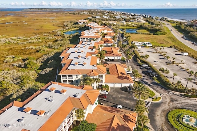 aerial view featuring a residential view and a water view