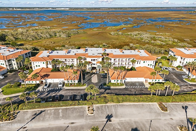 aerial view featuring a residential view and a water view