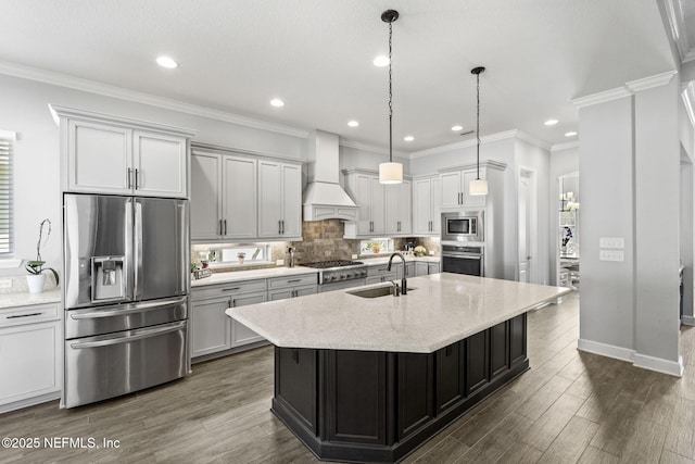 kitchen featuring ornamental molding, a sink, tasteful backsplash, appliances with stainless steel finishes, and custom exhaust hood