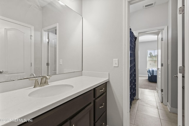 bathroom featuring tile patterned floors, visible vents, and vanity