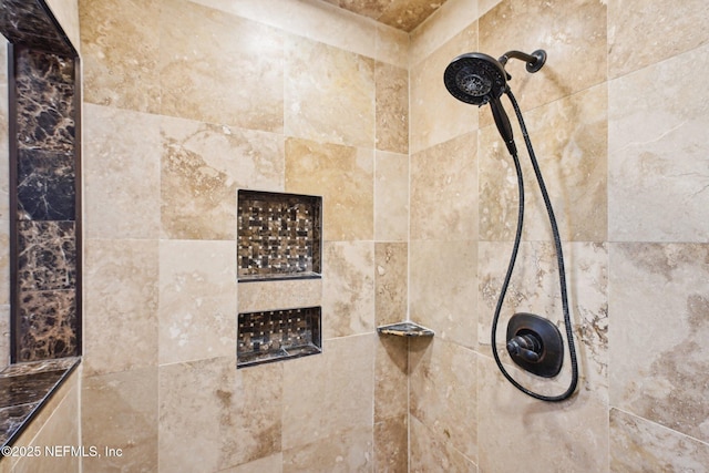 room details featuring a tile shower