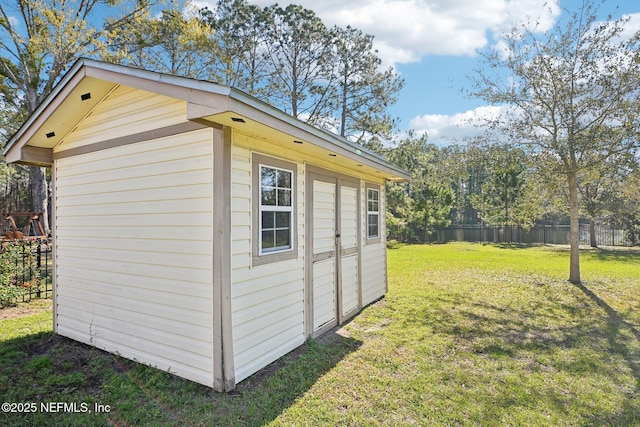 view of shed with fence