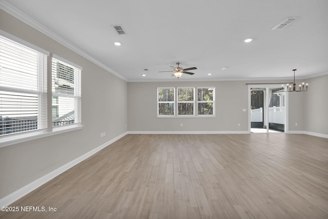 unfurnished living room featuring visible vents, light wood finished floors, baseboards, crown molding, and ceiling fan with notable chandelier