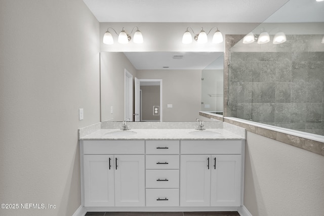 bathroom with a sink and double vanity