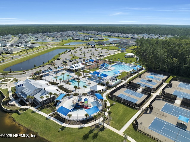 birds eye view of property featuring a residential view and a water view