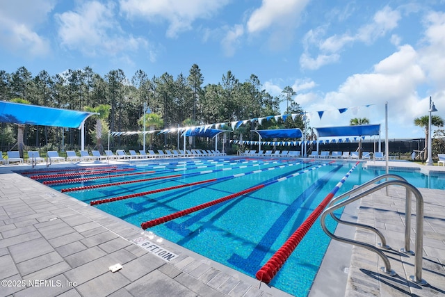 community pool with a patio area