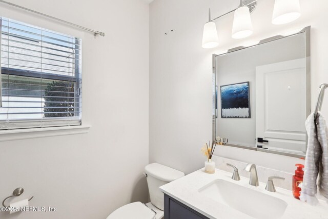 half bath with toilet and vanity