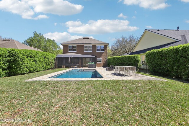 view of swimming pool featuring a yard, a patio area, and a fenced in pool