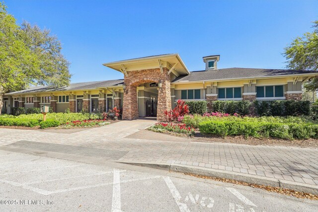 view of building exterior with driveway