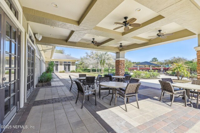 view of patio / terrace featuring outdoor dining area and a ceiling fan