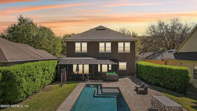 915 Brookhaven Dr, Saint Augustine, FL 32092 - rear view of house with a patio, an outdoor pool, stucco siding, and an outdoor hangout area