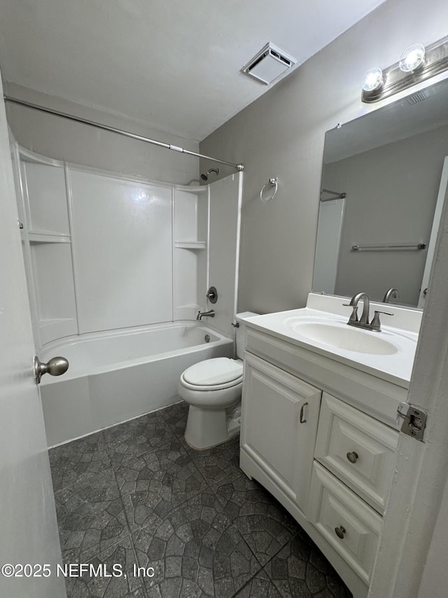 bathroom with visible vents, toilet, vanity, and bathing tub / shower combination