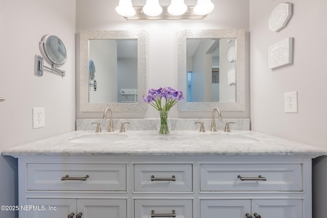 bathroom featuring double vanity and a sink