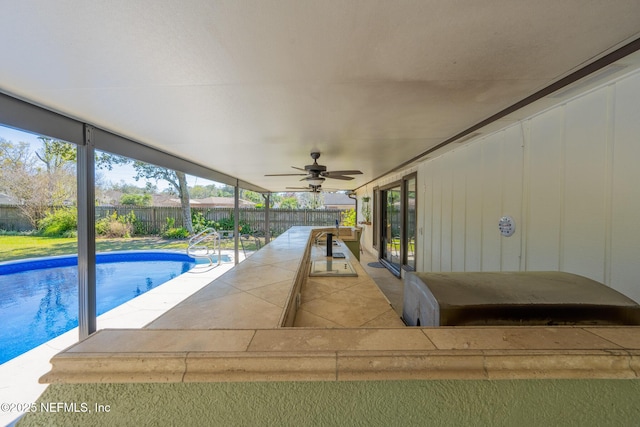 view of swimming pool featuring a patio, a fenced backyard, a fenced in pool, and ceiling fan