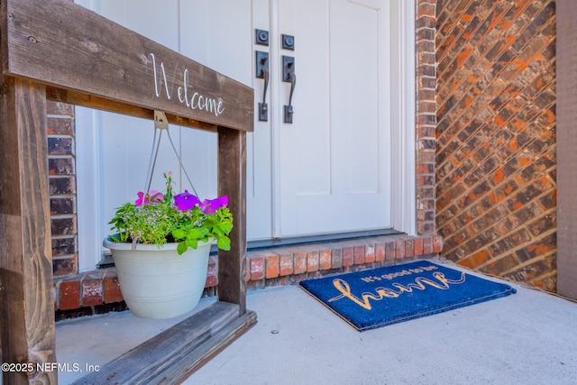 entrance to property with brick siding