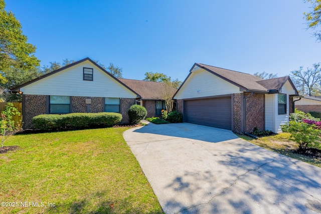 view of front facade featuring driveway, brick siding, an attached garage, and a front lawn