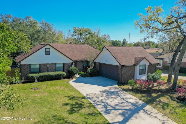 single story home with a front yard, roof with shingles, an attached garage, concrete driveway, and brick siding