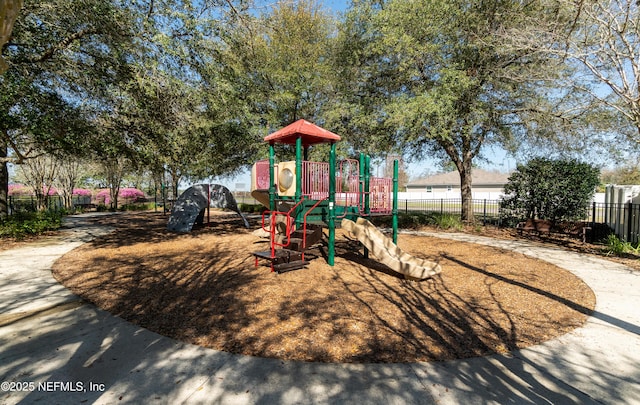 community jungle gym with fence