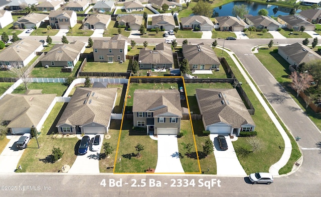 bird's eye view featuring a residential view and a water view