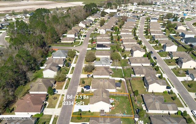 birds eye view of property with a residential view