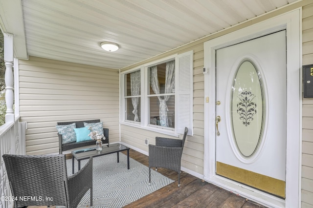 entrance to property featuring covered porch