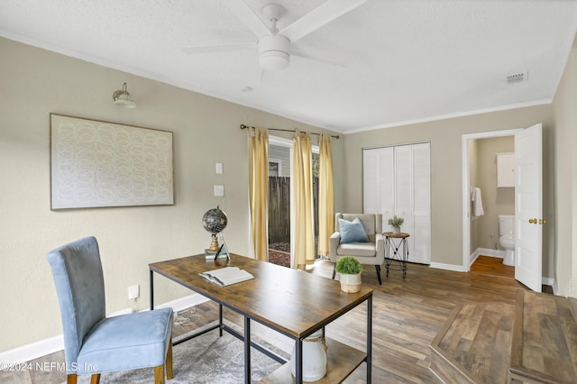 home office with visible vents, a ceiling fan, a textured ceiling, wood finished floors, and baseboards