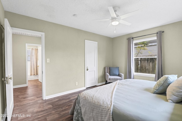 bedroom with ceiling fan, baseboards, a textured ceiling, and wood finished floors