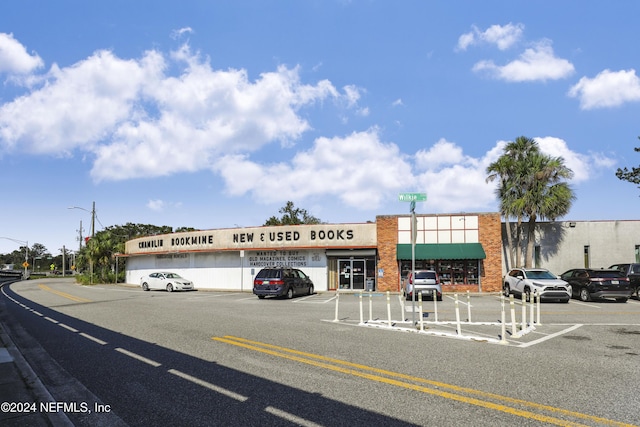 view of property featuring uncovered parking