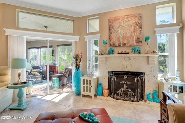 tiled living room with a fireplace and crown molding